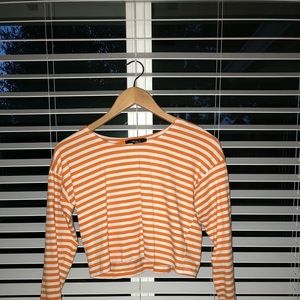 orange and white striped long sleeve crop top